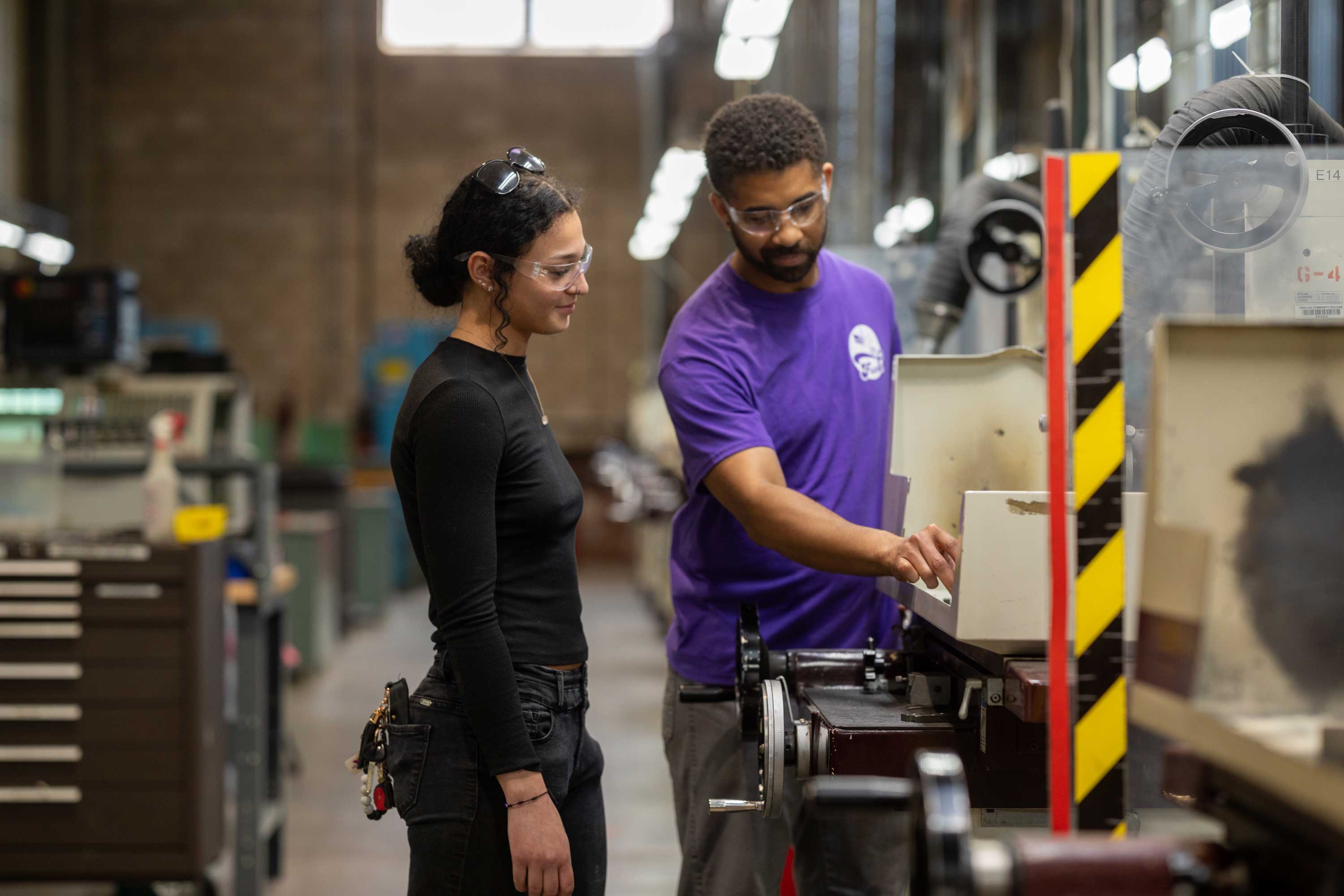Sinclair instructor showing a drone to a student.